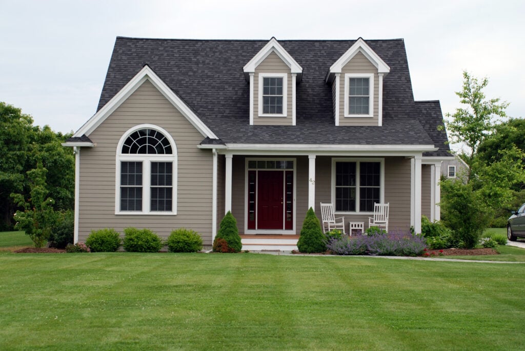 a beautiful house with lawn area in front