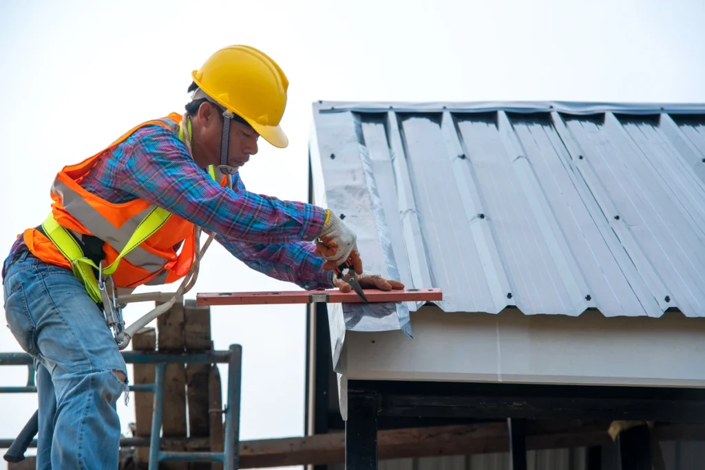 roof tech repairing section of metal roof