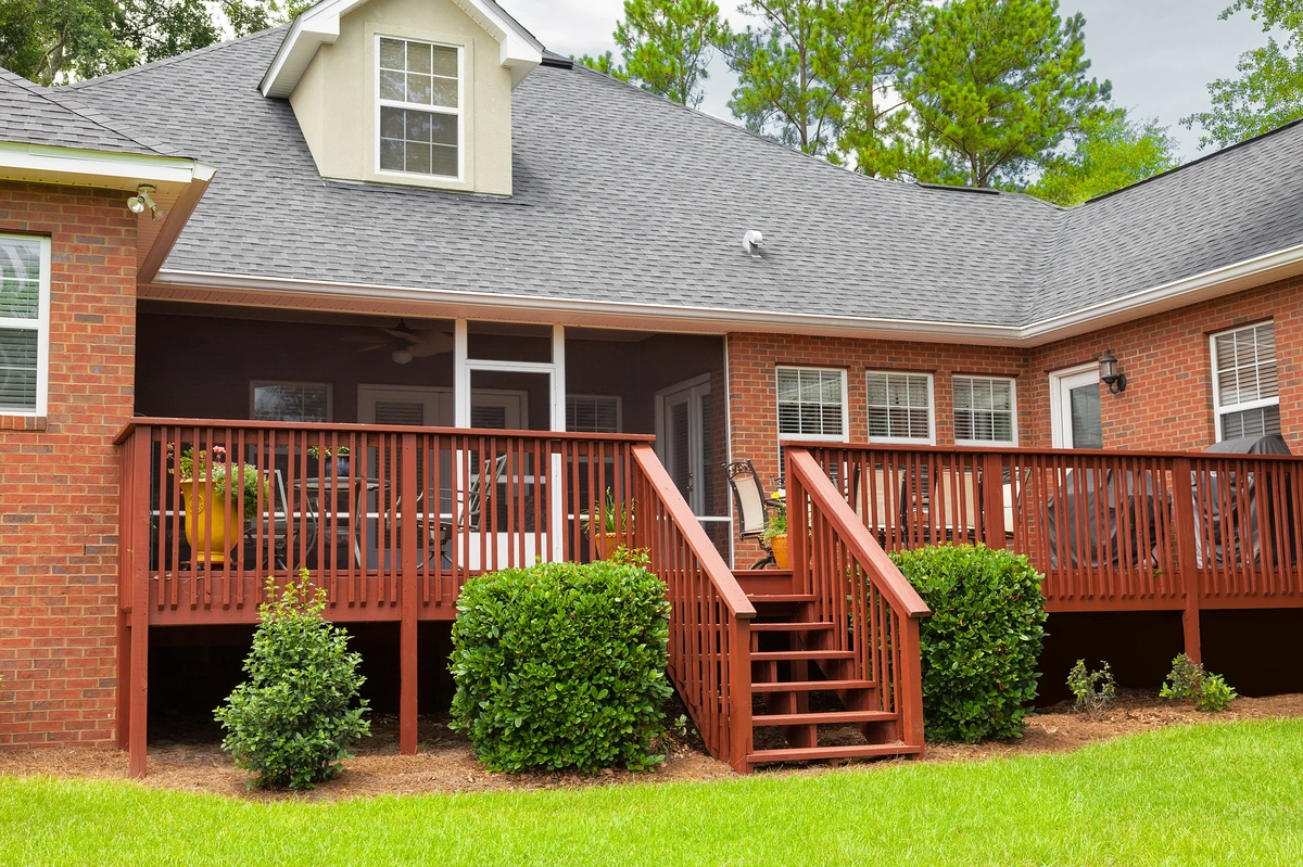 decks beaverton-brick home with a new wood deck