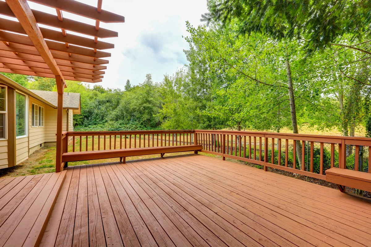 decks gresham-new brown wood deck with a wooded backyard
