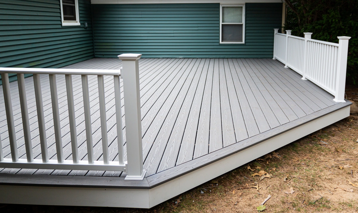 decks tualatin-dark teal sided home with a deck built off of it with white railing