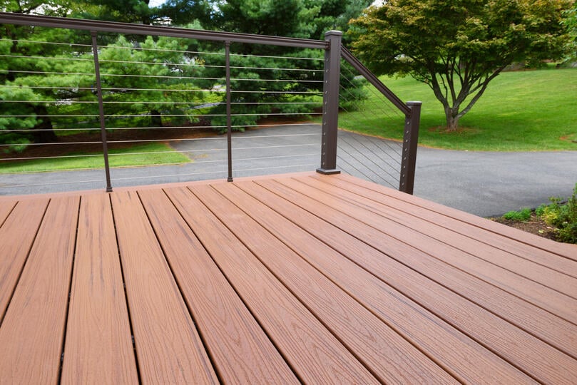 composite wood-close up image of composite deck with wire railing