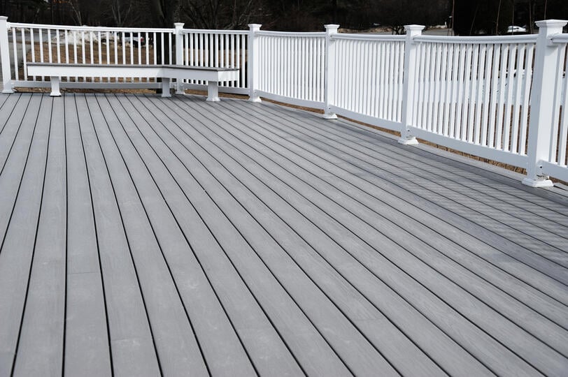 parts of a deck-gray deck with white railings
