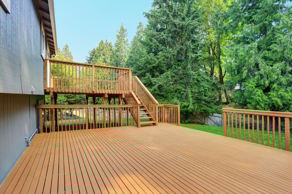 best decking material-house with a multi level wood deck
