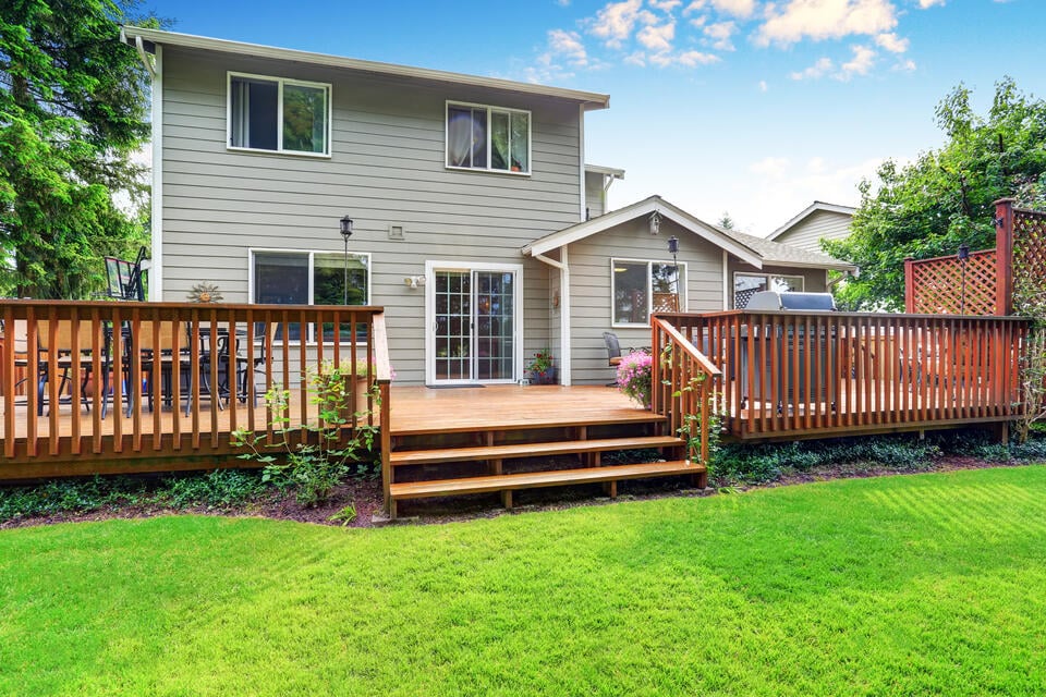 best decking material-house with a wood-like deck off the back