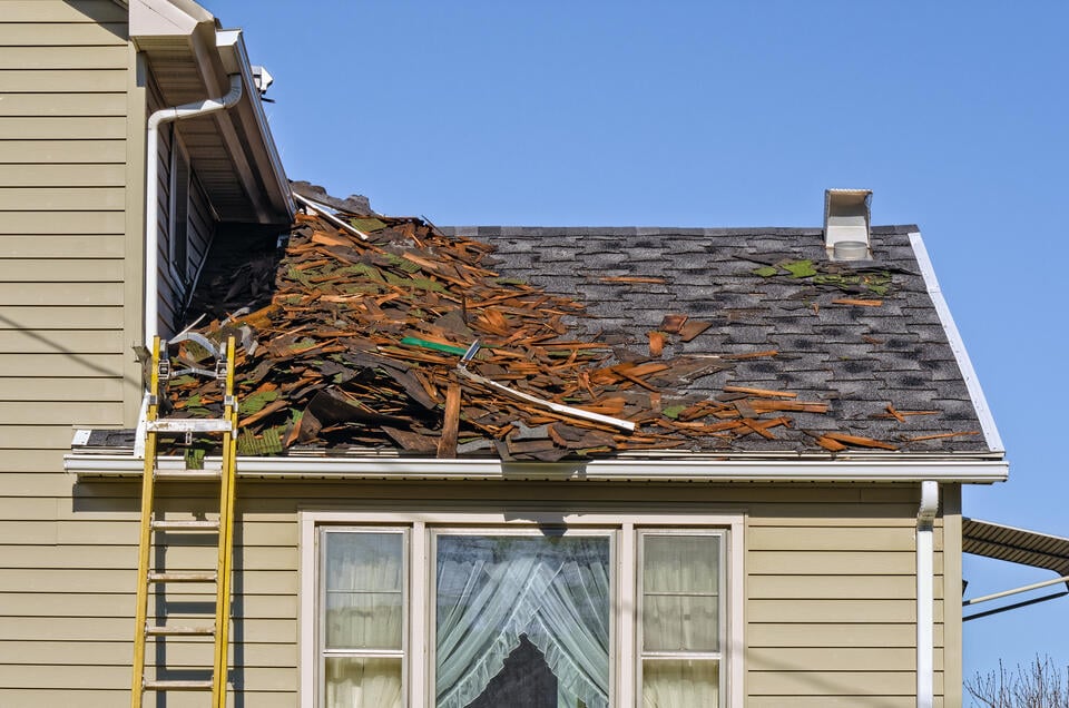 roof tear off-debris filling a roof during tear off