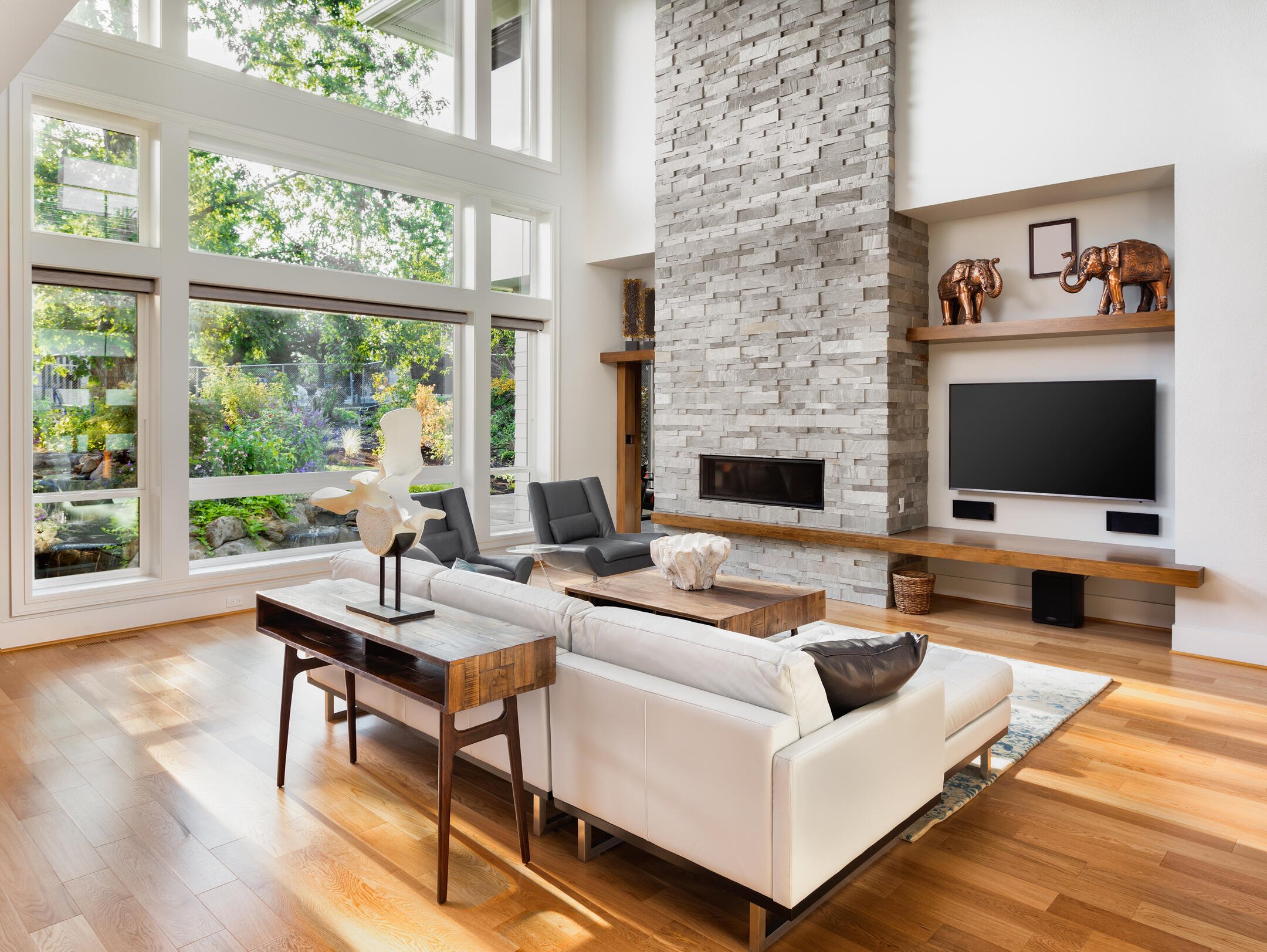 window replacement-west linn living room large fire place with new floor to ceiling windows