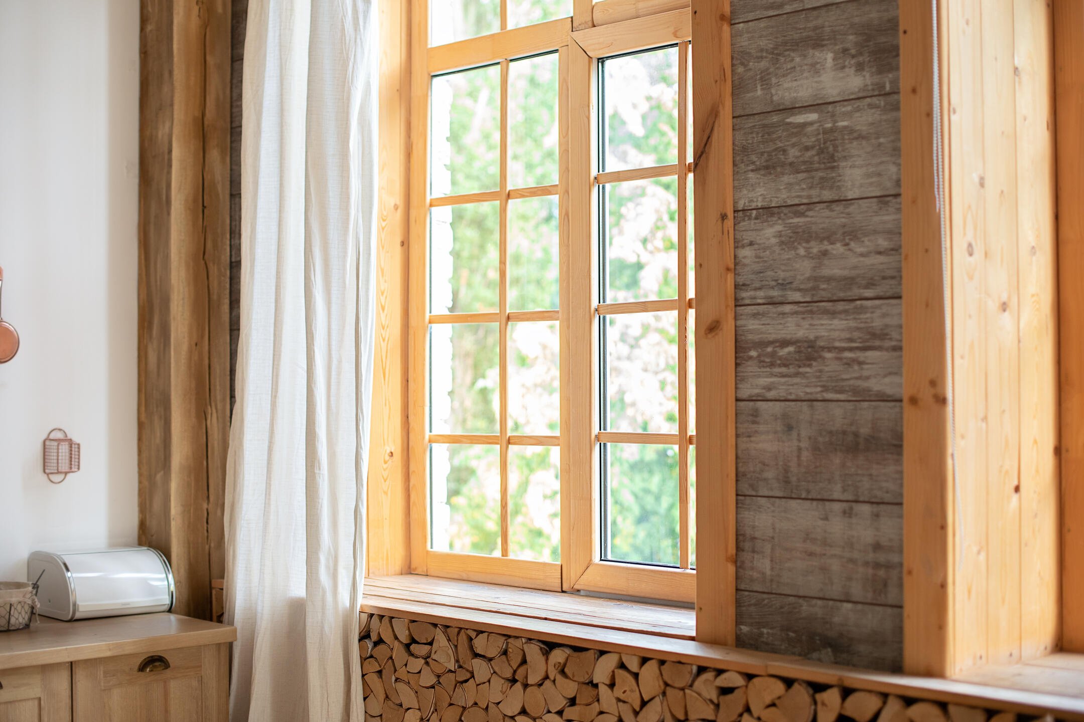 window casing-interior view of a rustic home with wood frames and casing around windows