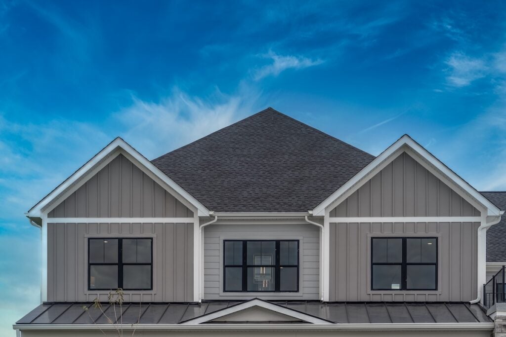 Family home with brown vertical siding