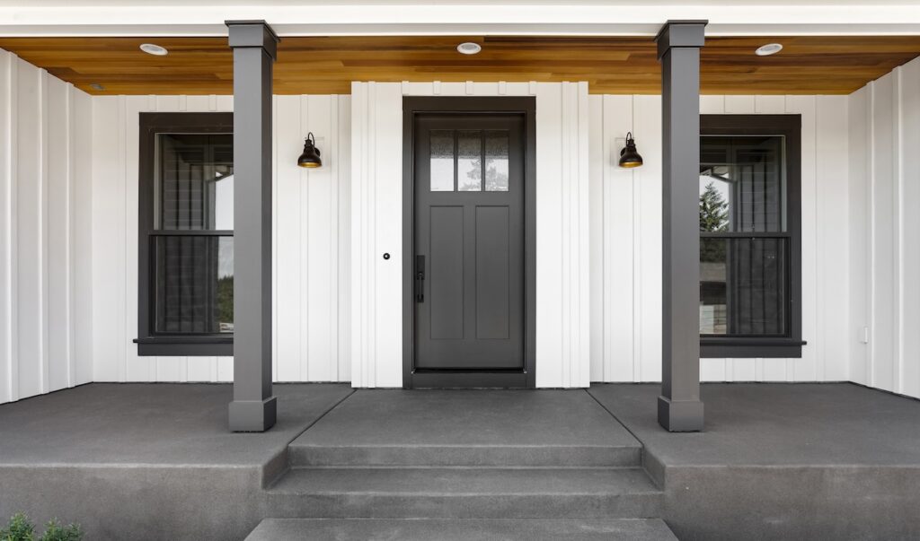 Modern house with vertical siding around entrance