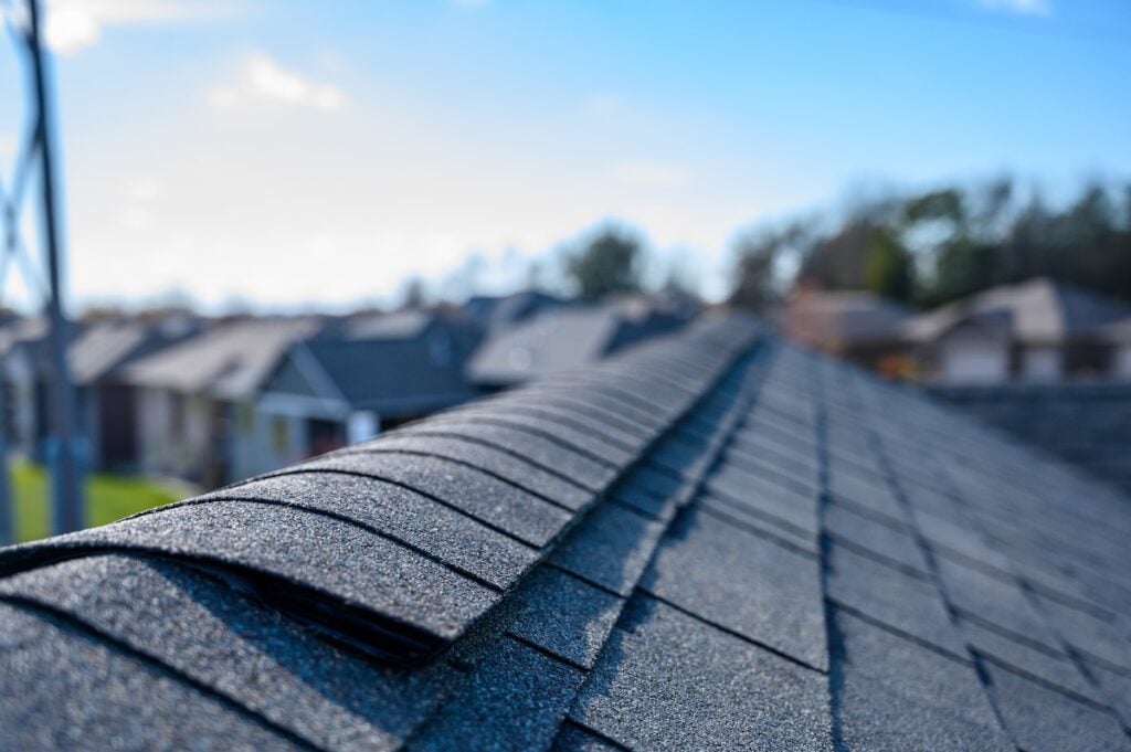 Asphalt shingles installed on the roof ridge