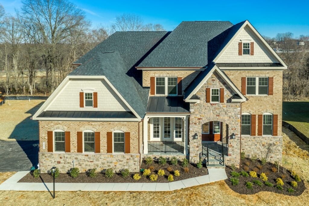 Luxury home in suburban neighborhood and gable roof