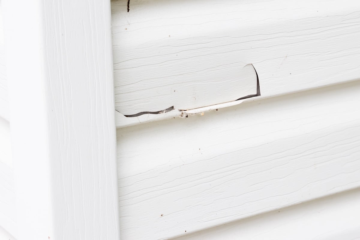 Cracked siding from storm damage