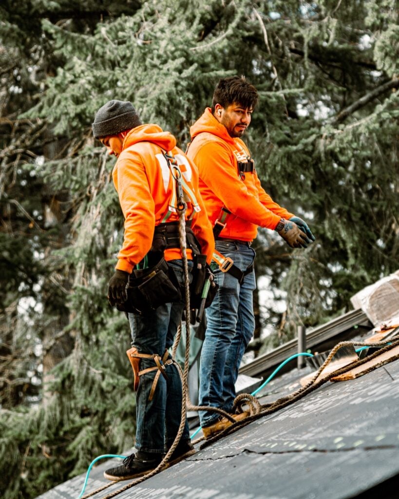 two boss exterior employees on roof