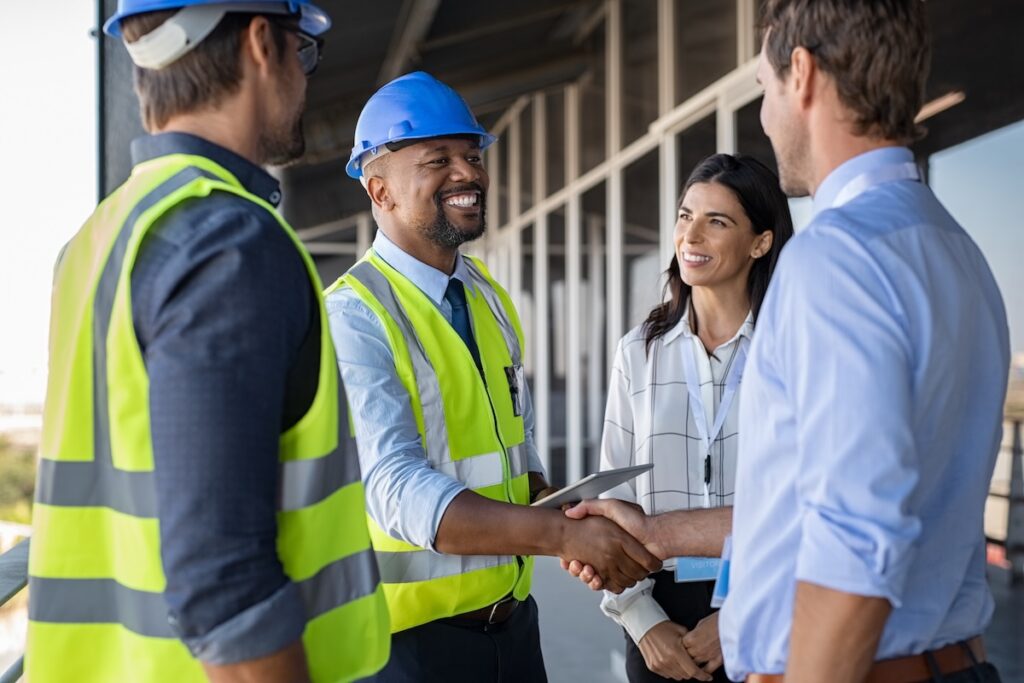 contractor shaking hands with commercial property owners