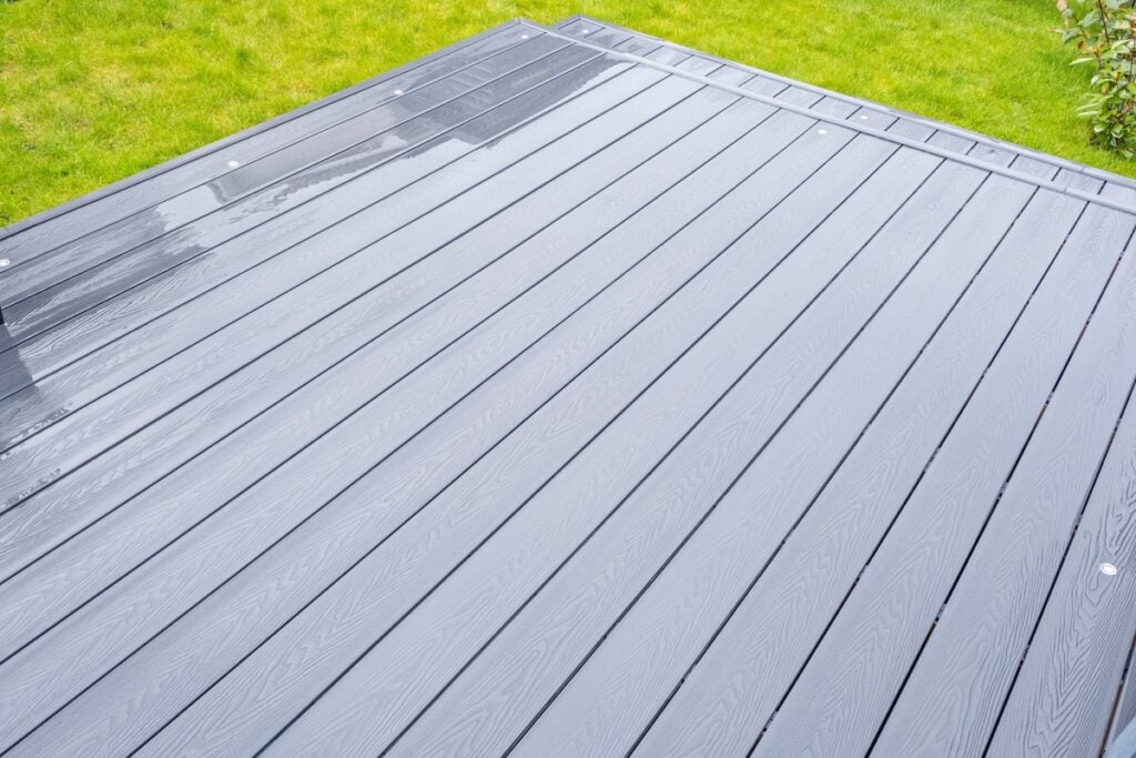Ash grey composite decking on a rainy wet day 